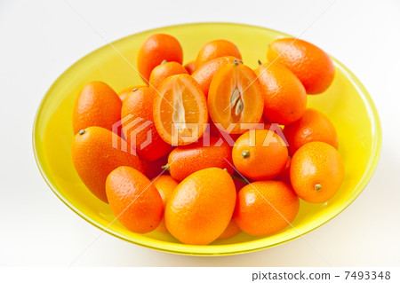 Fresh ripe Kumquats in a bowl Fresh ripe Kumquats in a bowl 7493348