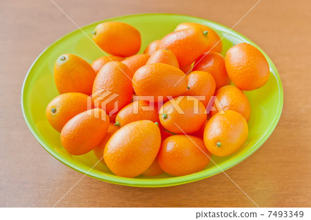 Fresh ripe Kumquats in a bowl 7493349