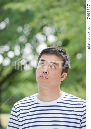 A man wearing a border T-shirt A man wearing a border T-shirt 7493827