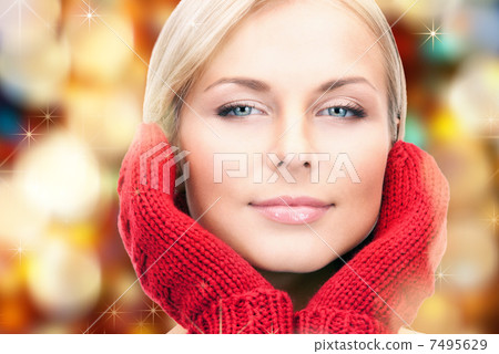 beautiful woman in red mittens 7495629