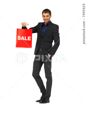 handsome man in suit with shopping bags 7495929