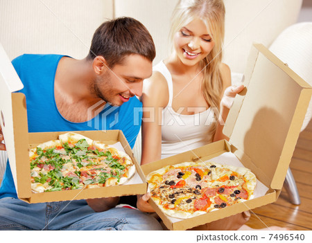 romantic couple eating pizza at home 7496540