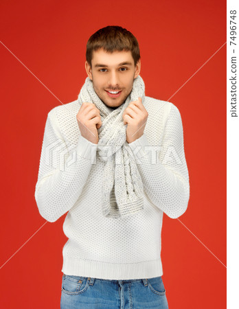 handsome man in warm sweater and scarf handsome man in warm sweater and scarf 7496748