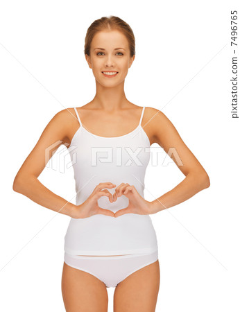 woman forming heart shape on belly woman forming heart shape on belly 7496765