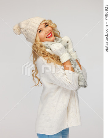 beautiful woman in hat, muffler and mittens 7496925