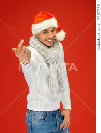 handsome man in christmas hat 7497776