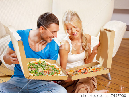 romantic couple eating pizza at home 7497900