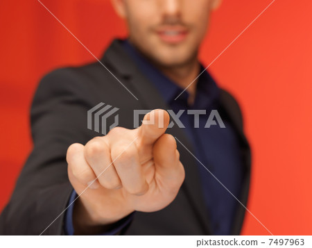 handsome man in suit pressing virtual button handsome man in suit pressing virtual button 7497963