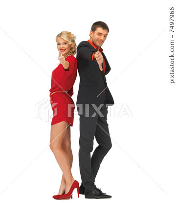 man and woman showing thumbs up, down 7497966