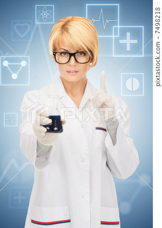 lab worker holding up test tube 7498218