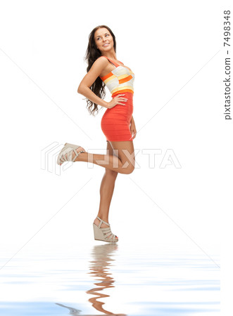 lovely woman in elegant dress on white sand lovely woman in elegant dress on white sand 7498348