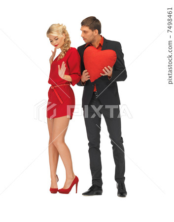 beautiful couple holding big heart 7498461