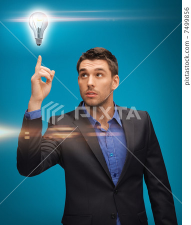 man in suit with light bulb 7499856
