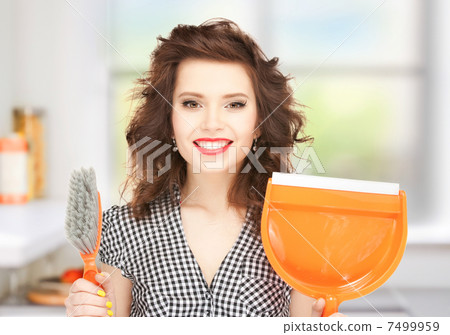beautiful woman with brush and pan 7499959