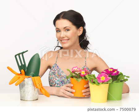 housewife with flower in pot and gardening set housewife with flower in pot and gardening set 7500079