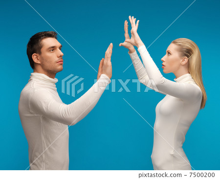 man and woman working with something imaginary man and woman working with something imaginary 7500200