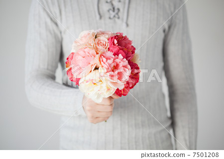 man holding bouquet of flowers 7501208