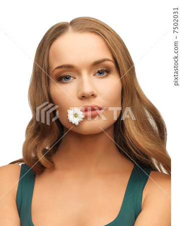 woman with camomile in mouth woman with camomile in mouth 7502031