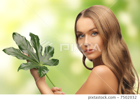 woman with green leaf woman with green leaf 7502032