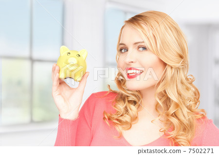 lovely woman with piggy bank 7502271