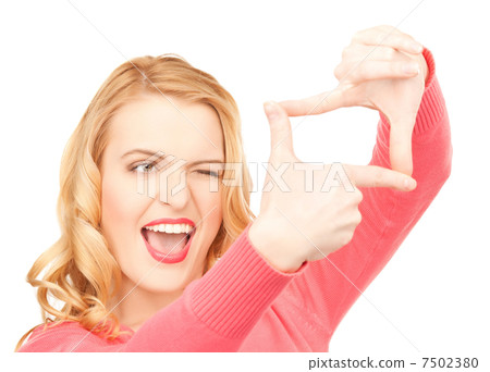 woman creating a frame with fingers or snapshot 7502380
