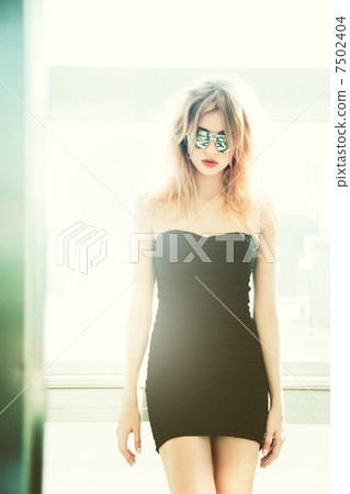 girl in sunglasses posing in elevator 7502404