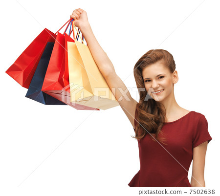 teenage girl in red dress with shopping bags 7502638