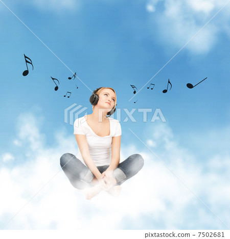 happy teenage girl in big headphones 7502681