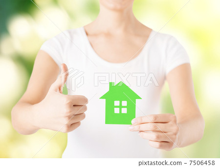 woman hands holding green house woman hands holding green house 7506458