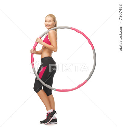 young sporty woman with hula hoop 7507498