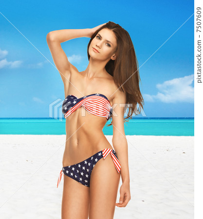 woman in bikini with american flag 7507609