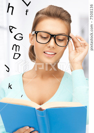 woman in glasses reading book woman in glasses reading book 7508136