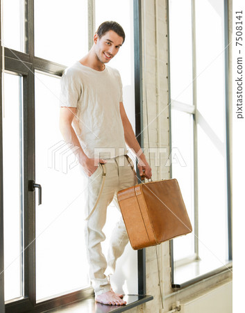 handsome man with retro suitcase handsome man with retro suitcase 7508141