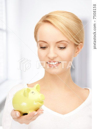 lovely woman with piggy bank lovely woman with piggy bank 7508158