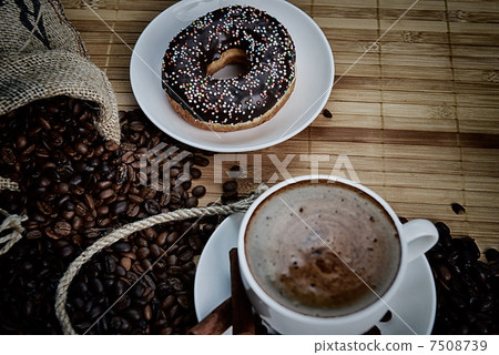 Cup of coffee on saucer Cup of coffee on saucer 7508739