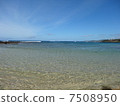 A blue sky and a calm sea 7508950