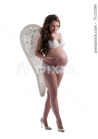 Young expectant woman with angel's wings Young expectant woman with angel's wings 7510394