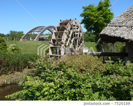 Water wheel in the water town park 7520189