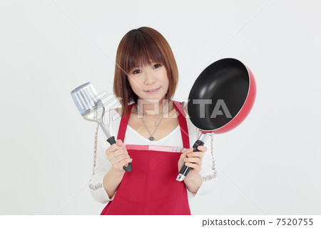 Young lady cooking 7520755