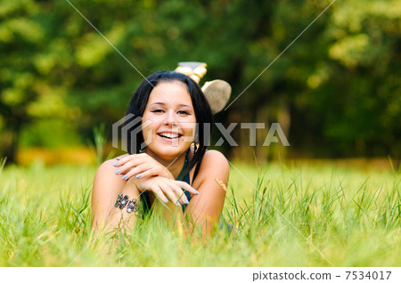 Pretty girl relaxing outdoor Pretty girl relaxing outdoor 7534017