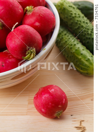 Fresh radish and cucumbers 7534761