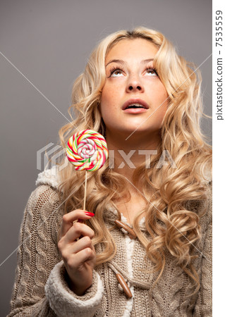Young woman with candy Young woman with candy 7535559