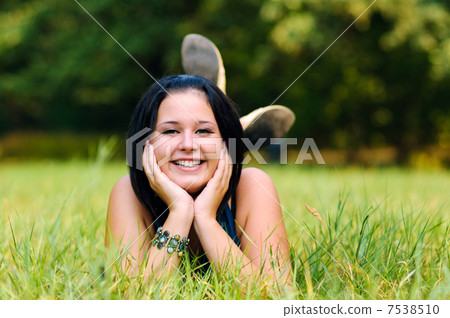 Pretty girl relaxing outdoor Pretty girl relaxing outdoor 7538510