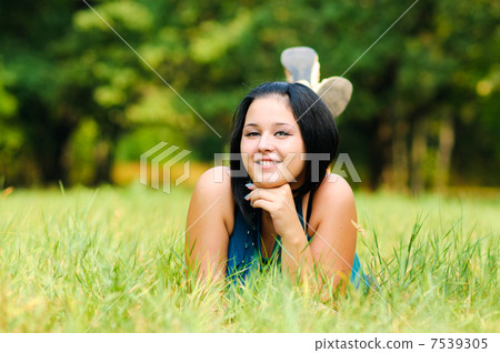 Pretty girl relaxing outdoor 7539305