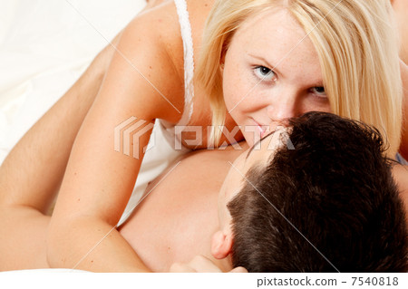 Loving affectionate heterosexual couple on bed. Loving affectionate heterosexual couple on bed. 7540818