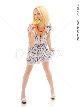 Attractive blonde eating lollipop Attractive blonde eating lollipop 7541831