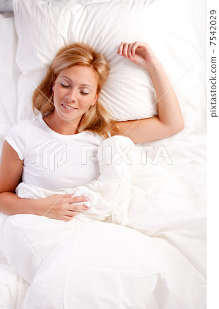 Young woman in bed. Young woman in bed. 7542029