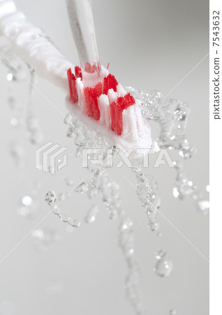 Toothbrush in a water splash Toothbrush in a water splash 7543632