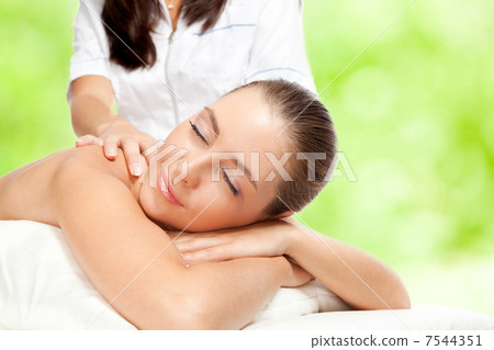 Beautiful woman at massage procedure Beautiful woman at massage procedure 7544351
