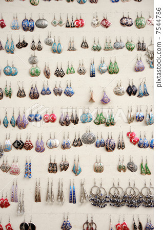 Ear rings on white background Ear rings on white background 7544786